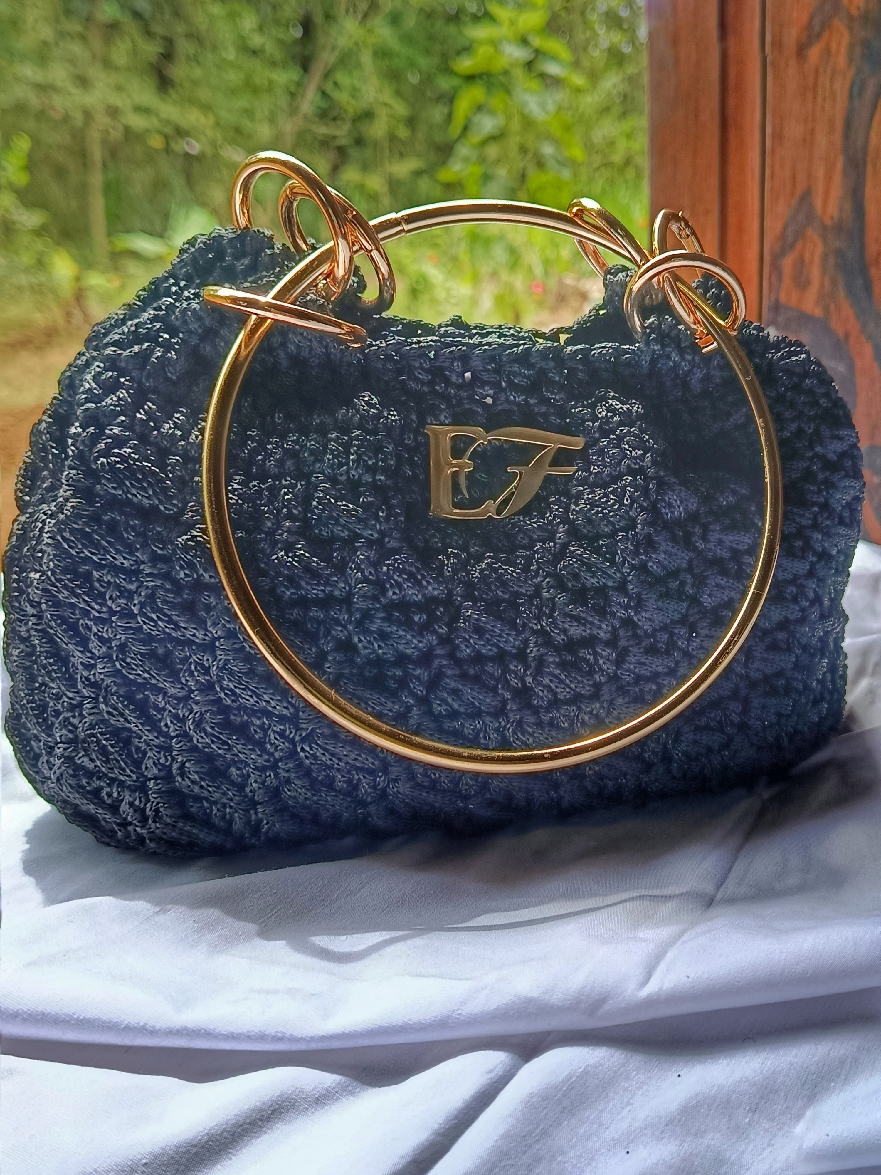 Royal loop bag in midnight tone.